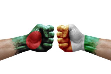 Two hands punch to each others on white background. Country flags painted fists, conflict crisis concept between bangladesh and ivory coast