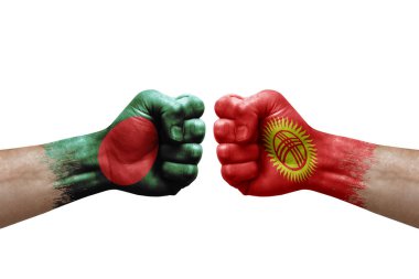 Two hands punch to each others on white background. Country flags painted fists, conflict crisis concept between bangladesh and kyrgyzstan