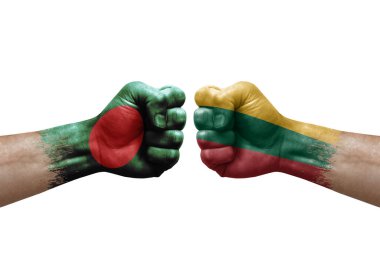 Two hands punch to each others on white background. Country flags painted fists, conflict crisis concept between bangladesh and lithuania