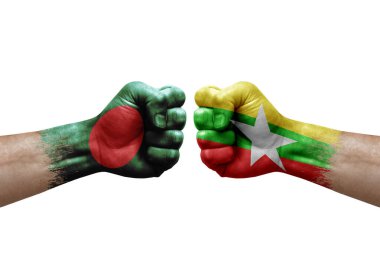 Two hands punch to each others on white background. Country flags painted fists, conflict crisis concept between bangladesh and myanmar