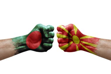 Two hands punch to each others on white background. Country flags painted fists, conflict crisis concept between bangladesh and north macedonia