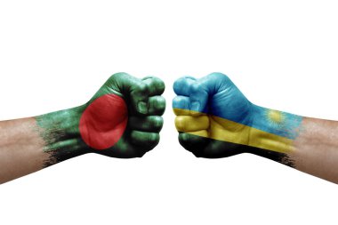 Two hands punch to each others on white background. Country flags painted fists, conflict crisis concept between bangladesh and rwanda