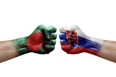 Two hands punch to each others on white background. Country flags painted fists, conflict crisis concept between bangladesh and slovakia