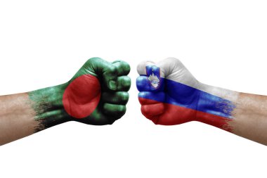 Two hands punch to each others on white background. Country flags painted fists, conflict crisis concept between bangladesh and slovenia