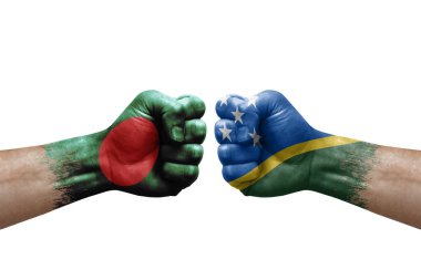 Two hands punch to each others on white background. Country flags painted fists, conflict crisis concept between bangladesh and solomon islands