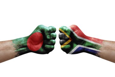 Two hands punch to each others on white background. Country flags painted fists, conflict crisis concept between bangladesh and south africa