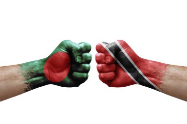 Two hands punch to each others on white background. Country flags painted fists, conflict crisis concept between bangladesh and tobago