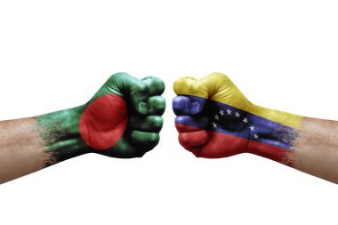 Two hands punch to each others on white background. Country flags painted fists, conflict crisis concept between bangladesh and venezuela