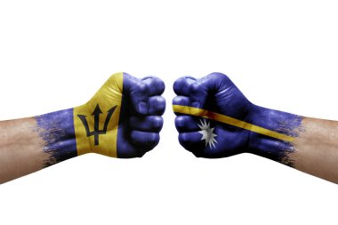 Two hands punch to each others on white background. Country flags painted fists, conflict crisis concept between barbados and nauru