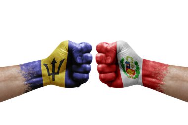 Two hands punch to each others on white background. Country flags painted fists, conflict crisis concept between barbados and peru