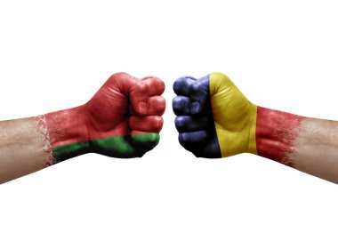 Two hands punch to each others on white background. Country flags painted fists, conflict crisis concept between belarus and chad