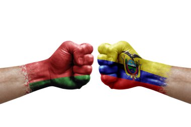 Two hands punch to each others on white background. Country flags painted fists, conflict crisis concept between belarus and ecuador