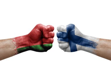 Two hands punch to each others on white background. Country flags painted fists, conflict crisis concept between belarus and finland