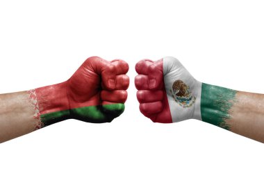 Two hands punch to each others on white background. Country flags painted fists, conflict crisis concept between belarus and mexico