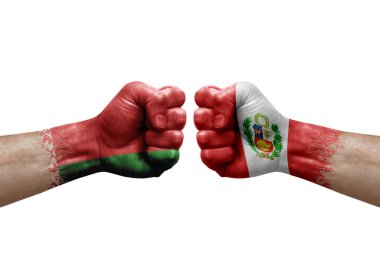 Two hands punch to each others on white background. Country flags painted fists, conflict crisis concept between belarus and peru