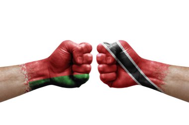 Two hands punch to each others on white background. Country flags painted fists, conflict crisis concept between belarus and tobago