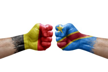 Two hands punch to each others on white background. Country flags painted fists, conflict crisis concept between belgium and dr congo