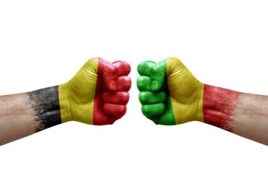 Two hands punch to each others on white background. Country flags painted fists, conflict crisis concept between belgium and mali
