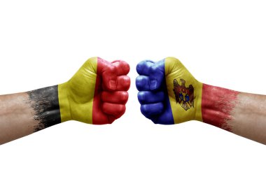 Two hands punch to each others on white background. Country flags painted fists, conflict crisis concept between belgium and moldova
