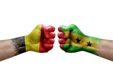 Two hands punch to each others on white background. Country flags painted fists, conflict crisis concept between belgium and sao tome and principe