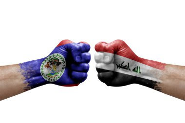 Two hands punch to each others on white background. Country flags painted fists, conflict crisis concept between belize and iraq