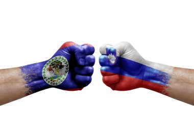 Two hands punch to each others on white background. Country flags painted fists, conflict crisis concept between belize and slovenia