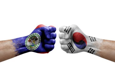 Two hands punch to each others on white background. Country flags painted fists, conflict crisis concept between belize and south korea