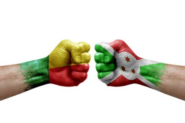 Two hands punch to each others on white background. Country flags painted fists, conflict crisis concept between benin and burundi