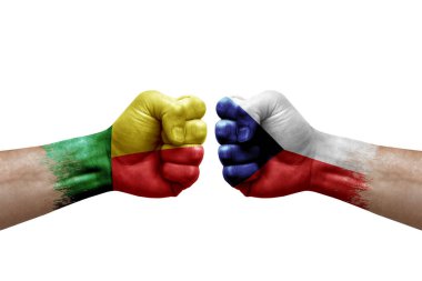 Two hands punch to each others on white background. Country flags painted fists, conflict crisis concept between benin and czechia