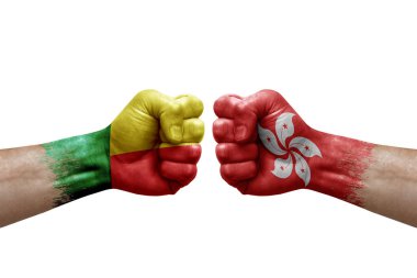 Two hands punch to each others on white background. Country flags painted fists, conflict crisis concept between benin and hong kong