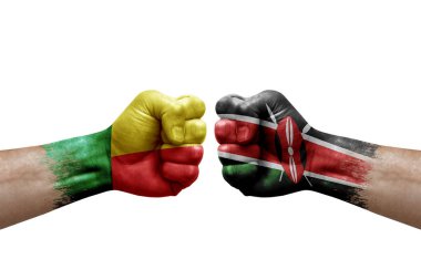 Two hands punch to each others on white background. Country flags painted fists, conflict crisis concept between benin and kenya