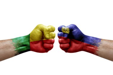 Two hands punch to each others on white background. Country flags painted fists, conflict crisis concept between benin and liechtenstein