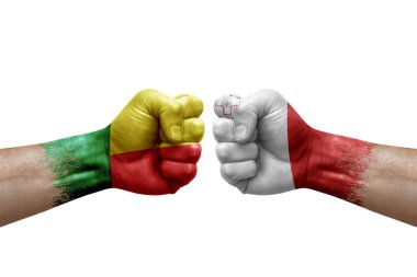Two hands punch to each others on white background. Country flags painted fists, conflict crisis concept between benin and malta