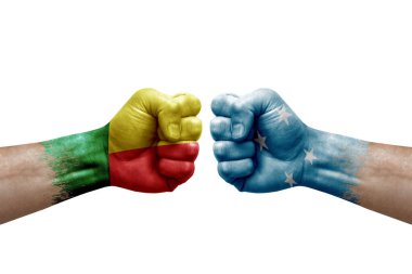 Two hands punch to each others on white background. Country flags painted fists, conflict crisis concept between benin and micronesia