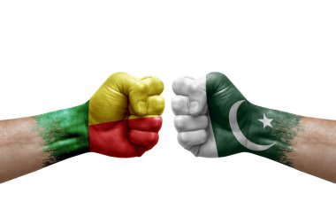 Two hands punch to each others on white background. Country flags painted fists, conflict crisis concept between benin and pakistan
