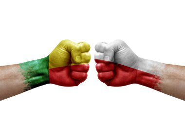 Two hands punch to each others on white background. Country flags painted fists, conflict crisis concept between benin and poland