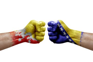 Two hands punch to each others on white background. Country flags painted fists, conflict crisis concept between bhutan and bosnia