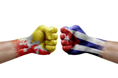 Two hands punch to each others on white background. Country flags painted fists, conflict crisis concept between bhutan and cuba