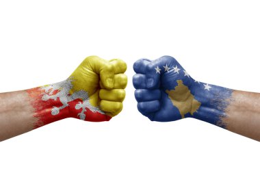 Two hands punch to each others on white background. Country flags painted fists, conflict crisis concept between bhutan and kosovo