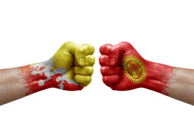 Two hands punch to each others on white background. Country flags painted fists, conflict crisis concept between bhutan and kyrgyzstan