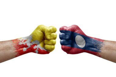 Two hands punch to each others on white background. Country flags painted fists, conflict crisis concept between bhutan and laos