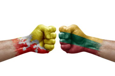 Two hands punch to each others on white background. Country flags painted fists, conflict crisis concept between bhutan and lithuania