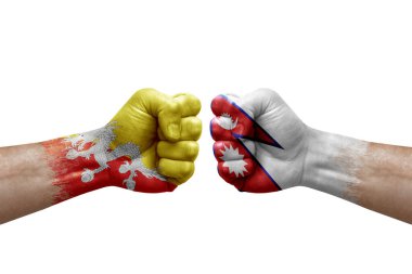 Two hands punch to each others on white background. Country flags painted fists, conflict crisis concept between bhutan and nepal