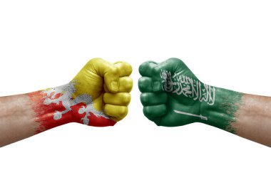 Two hands punch to each others on white background. Country flags painted fists, conflict crisis concept between bhutan and saudi arabia