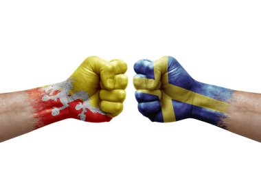 Two hands punch to each others on white background. Country flags painted fists, conflict crisis concept between bhutan and sweden