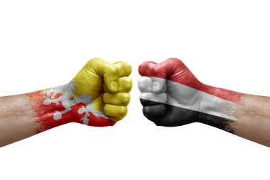 Two hands punch to each others on white background. Country flags painted fists, conflict crisis concept between bhutan and yemen