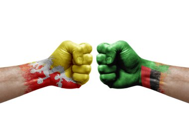 Two hands punch to each others on white background. Country flags painted fists, conflict crisis concept between bhutan and zambia