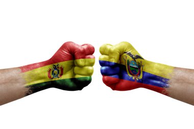 Two hands punch to each others on white background. Country flags painted fists, conflict crisis concept between bolivia and ecuador