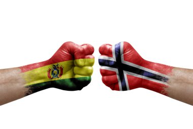 Two hands punch to each others on white background. Country flags painted fists, conflict crisis concept between bolivia and norway