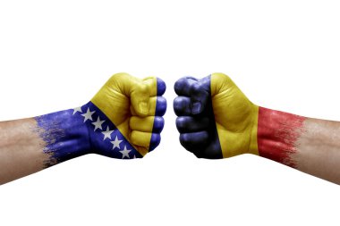 Two hands punch to each others on white background. Country flags painted fists, conflict crisis concept between bosnia and chad